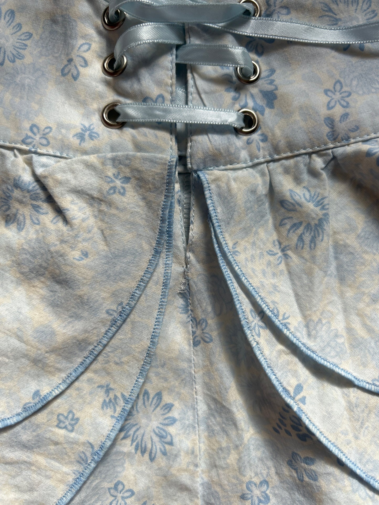 vintage 00s white and blue ruffle mini skirt with lace up detail