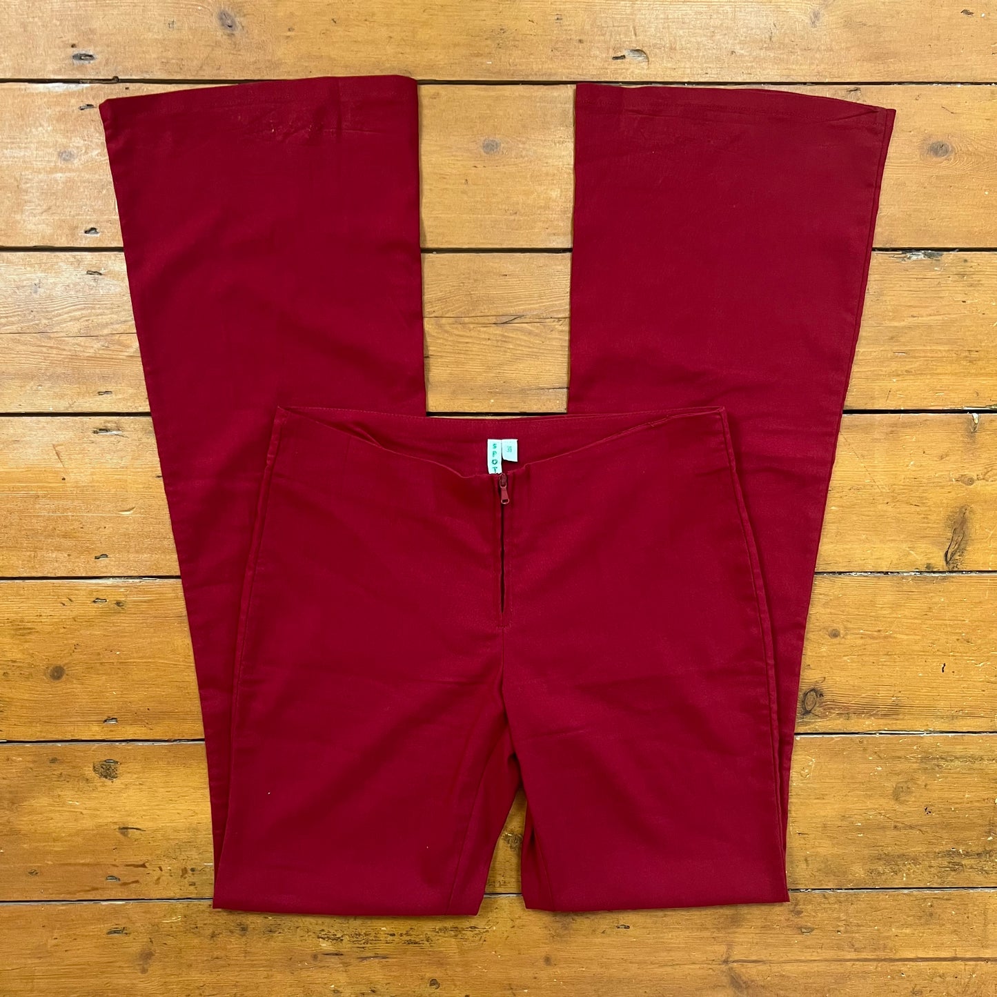 vintage 00s red flared trousers with front zip