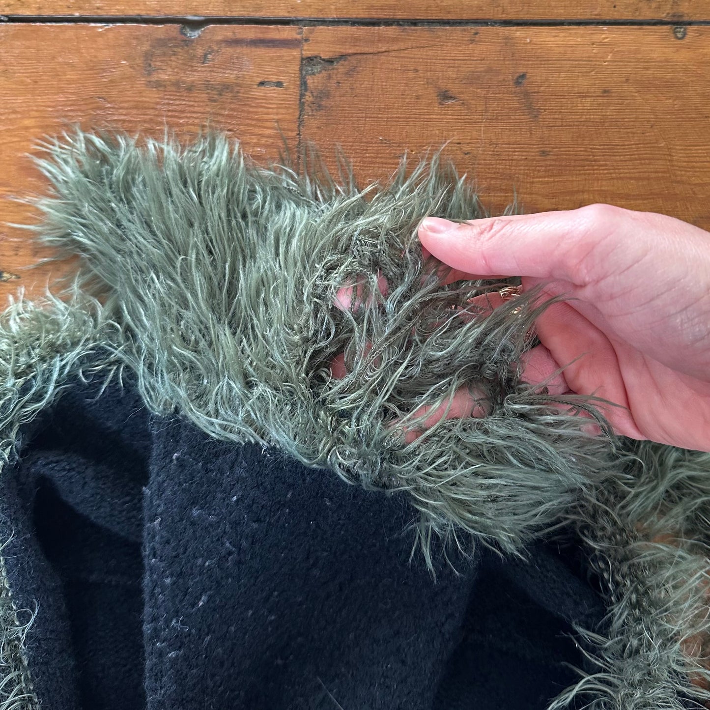 vintage 00s black knit long sleeve with green fur trim