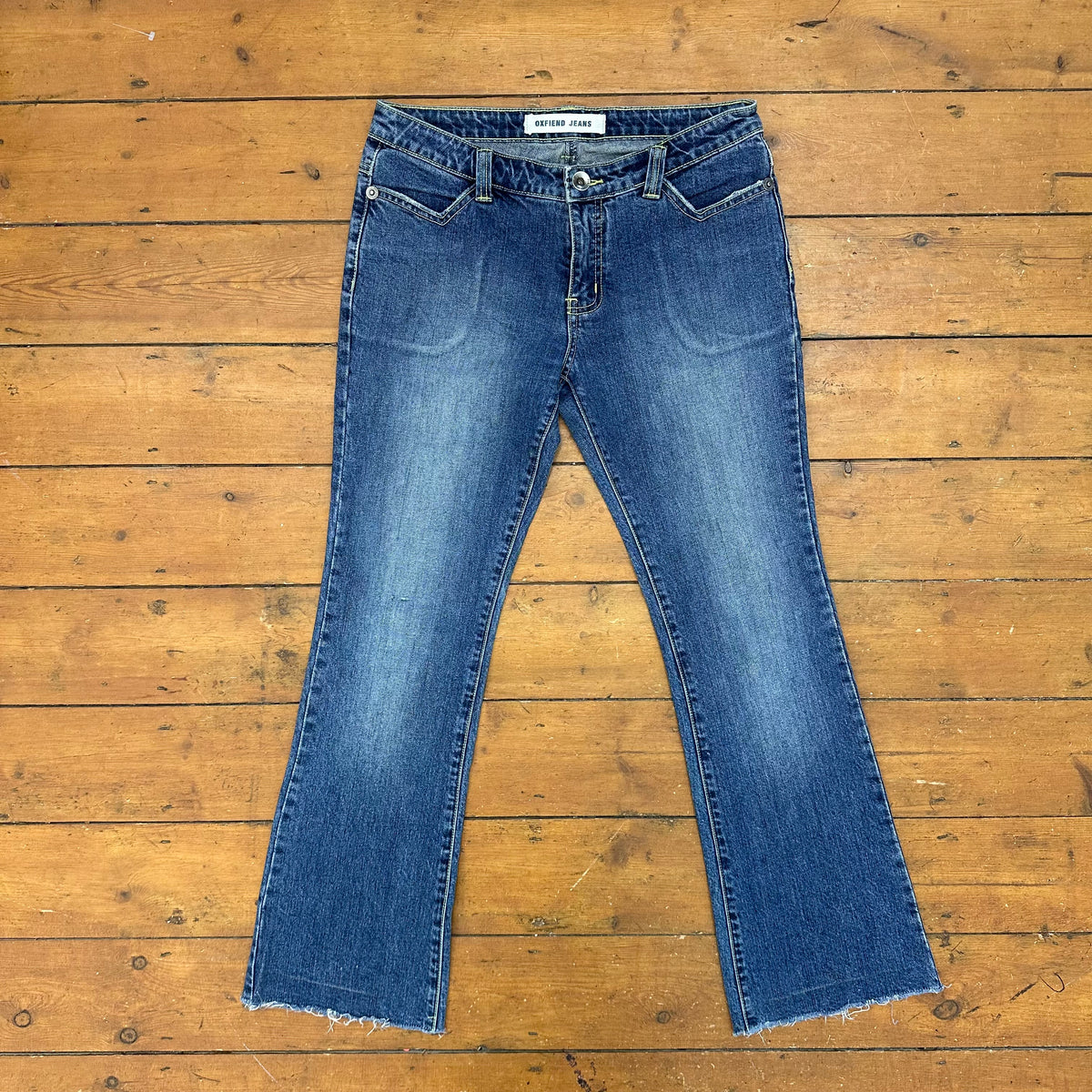 vintage 00s dark wash low rise bootleg jeans with back pocket embroidery